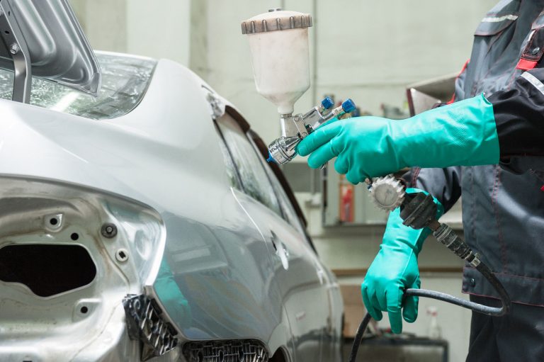 Painting a car in Crown Repair Center